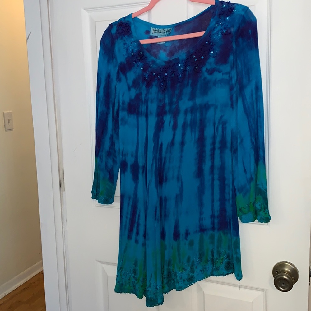 One Size ( best for medium thru XL) gauzy tunic top with asymmetrical hem.